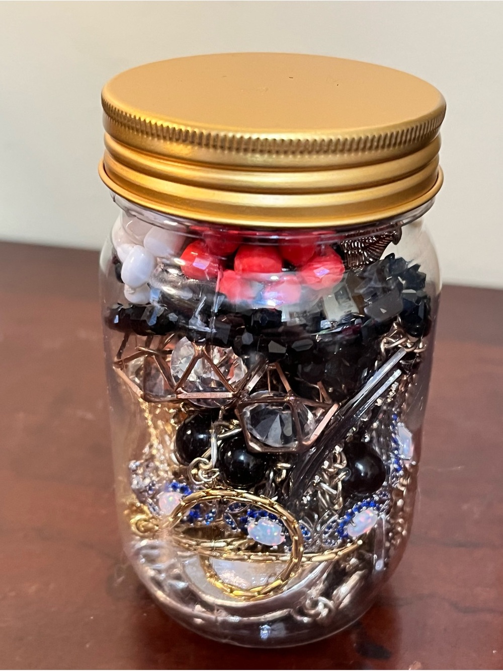 Glass Jar of Mixed Costume Jewelry with Gold Lid